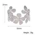 Macro detail of silver floral stainless steel bangle with dimensions 31mm height and 55mm diameter - Silver