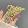 Golden wheat-shaped hair claw clip with green rhinestones and silver crystal bow knot - Golden Wheat