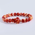 Detail of beaded bracelet with red and yellow beads featuring a central turtle charm - Red Yellow Spotted Turtle Bracelet