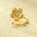 Macro shot of 18K gold flower ring featuring white shell inlay and zircon stone detailing - One Size (Adjustable Open) / Double Flower Design (Gold + White Shell)