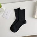 Calze nere da donna in cotone a coste con bordo arrotolato dal design minimalista - Taglia unica / Nero