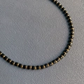 Handmade beaded necklace with black faceted square beads and small golden spacers - 20#