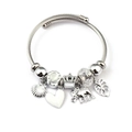 Detail of twisted cable charm bracelet with shell, heart, and crown pendants - White