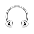 Macro detail of silver horseshoe piercing with heart-shaped ends and polished finish - Silver Heart