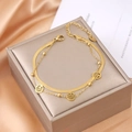 Double-layer gold-plated tree of life bracelet featuring snake chain and bead details - Gold