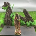 Macro detail of hand-carved Virgin Mary statue in natural semi-precious stone - Pink Tourmaline