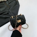 Chic black quilted crossbody bag with golden chain strap and metallic turn-lock closure - Black