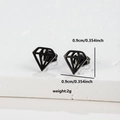 Macro shot of 0.9cm black hollow diamond stud earrings on a textured stone base - 060 Diamond Black
