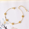 Elegant gold-tone chain bracelet featuring five clover pendants and adjustable clasp - Four-Leaf Clover