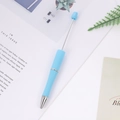 DIY beadable pen in light blue finish with metallic rod on a minimalist background - Macaron Blue