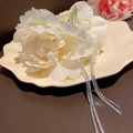 Elegant white lily hair claw clip with long rhinestone tassels on a beige dish - Light Yellow Flower Tassel Claw Clip (94#)
