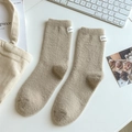 Thick warm camel wool socks with Honey label in a cozy minimalist aesthetic setup - One Size / Camel