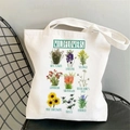 White floral canvas tote bag featuring botanical wildflower illustrations and text - STD704-G Wildflowers