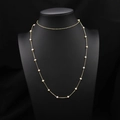 Elegant long gold chain necklace with polished white freshwater pearls on a black display - Symmetrical Fixed Sweater Chain