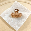 Golden alloy hair claw with elegant triple seashell design on white mineral base - Triple Shell Claw