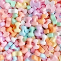 Macro view of colorful bone-shaped resin beads in various pastel shades for hair accessories - Letter I (Random Mixed One) / Small