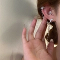 Detailed close-up of a silver star moon tassel ear cuff and earring set worn on an ear. - Ear Cuff & Stud Integrated Style (Pair) / Silver