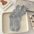 Light blue-grey cotton crew socks with vertical rib knit texture and woven label detail - One Size / Milky Blue