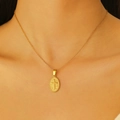 Close-up of a 18k gold plated oval pendant featuring a cross on a delicate chain - 18K Real Gold H-166 Oval Plate Cross Necklace
