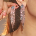 Luxurious pink rhinestone long fringe tassel earrings worn by a model in close-up - Flat Style / Pink Rhinestone