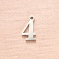 Macro detail of polished stainless steel number 4 pendant for DIY jewelry making - Steel Color Number 4