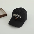 Detailed close-up of kids' black sun hat featuring white bear and letter embroidery - 50-52cm (2-5 Years) / Black