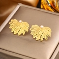 Macro view of gold leaf stud earrings with wavy texture and white pearl detail - Gold White Pearl