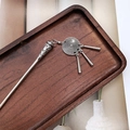 Detail of silver ethnic hair pin with tassel pendants on a vintage wooden tray - F0742 Hair Stick-11# (Concentric Circle Embossed Column Tassel)
