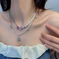 Double-layer pearl necklace with colorful square crystal pendants on a female model - Fashion Double Layer Artificial Pearl Colorful Square Gem Necklace (X1926)