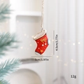 Mini resin Christmas stocking ornament with gold bow and bell on rustic jute string - Red Sock