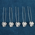 Close-up of five silver U-shaped hair pins with floral rhinestone crystals on blue velvet - Intricate Flower Style (FZ-001) / 5 Pcs Set / Silver