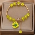 Yellow sunflower beaded bracelet with translucent crackle beads and golden chain link - Yellow Crackle Bead Sunflower Pendant Bracelet (3987)