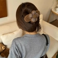 Brown fuzzy hair claw clip with checkered flower worn on head in cozy setting - Dark Coffee Flower