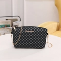 Women's black crossbody bag with gray circular geometric pattern and gold chain strap - Black