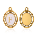 Golden oval pendant with white enamel and initial F, front and back view on white background - Letter F