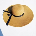 Yellow wide-brim straw sun hat with black ribbon bow decoration in flat lay view - M (56-58cm) / Yellow (Plain)