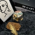 Scented candle in bohemian mandala pattern tin jar on a luxurious plush grey rug - H03 Cocoa