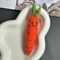 Handmade orange wool felt carrot keychain with green leaves and smile on cloud tray - Carrot