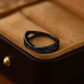 Crossed black metal ring with pave-set blue zircon stones in a velvet gift box - US Size 6 / Gun Black - Blue Zirconia