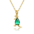 Detailed view of an 18K gold dinosaur necklace with a teardrop green gemstone pendant - Green Cartoon Dinosaur (XL00311)