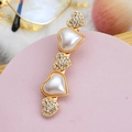 Detailed close-up of a heart-shaped gold hair clip with pearls and rhinestones - Style 08-Heart Duo
