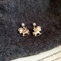 Macro shot of gold-plated rocking horse earrings with pearls and shimmering zircons - Silver Earring Post - Gold (Real Gold Plated)