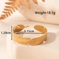 Bracciale a fascia larga regolabile a forma di piuma in acciaio al titanio dorato lucido - Stile Piuma