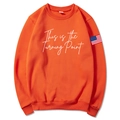 Unisex bright orange hoodie with white text print and American flag sleeve patch - Orange