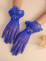 Detail of royal blue mesh lace bridal gloves with satin bow and pearl accent - Sapphire Blue