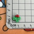 Mini resin Christmas holly leaves and berries DIY accessory on a ruler for size scale - Holly Leaves