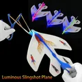 Blue LED light-up catapult airplane toy with rocket pattern for nighttime outdoor play - Glowing Catapult Plane