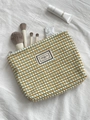 Knitted checkerboard cosmetic bag in blue and yellow with metallic zipper closure - Blue and Yellow