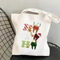White canvas tote bag with Christmas dental print featuring reindeer antlers and Santa hat - C8 Christmas Red Green Teeth