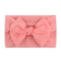 Soft coral pink nylon baby headband featuring a large bow for infants and toddlers - Coral Pink